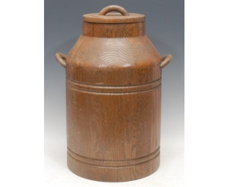 An early 20th century oak panelled milk churn and cover, two-handled, 48cm high overall