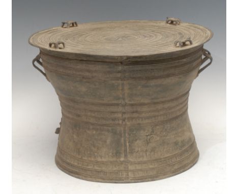 A Southeast Asian bronze frog or rain drum, the concentric ring top with central star motif, surmounted with four frog finial