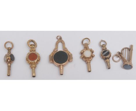 A novelty gold mounted sardonyx set watch key, as a Harp, plain matrix, 2.5cm long; another folding with bloodstone and sardo
