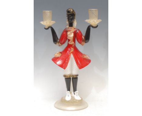 A Venetian Murano glass figurative candelabra, the column as a Blackamoor holding a pair of twist turned sconces in each hand