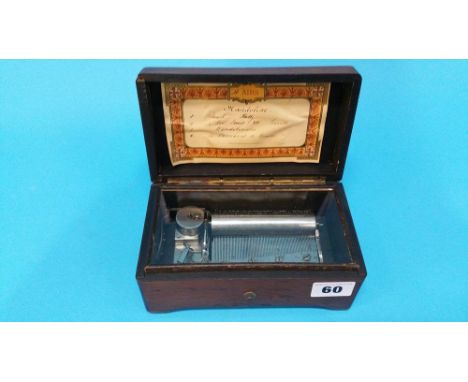 A small travelling musical box playing four airs.17 cm long