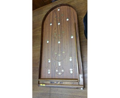 A Corinthian bagatelle table.