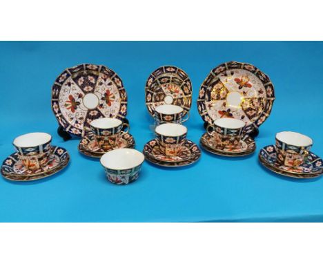 A Royal Crown Derby tea set, comprising two cake plates, sugar bowl, six cups, saucers and side plates, red printed mark, num