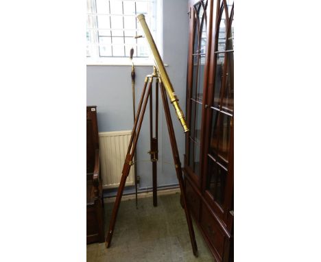 Reproduction brass telescope on extendable tripod and a winding pole.
