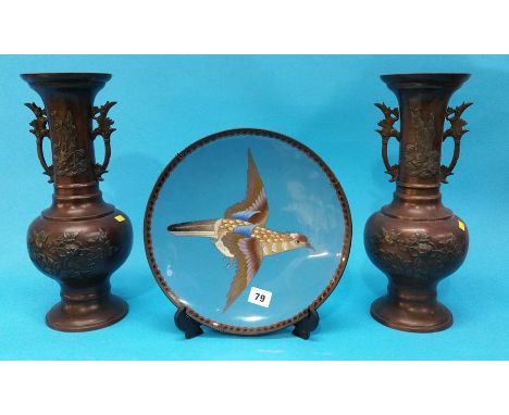 A Cloisonné enamel circular wall plate decorated with a bird and a pair of Oriental vases.