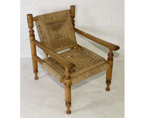A vintage seagrass armchair with light wood frame 