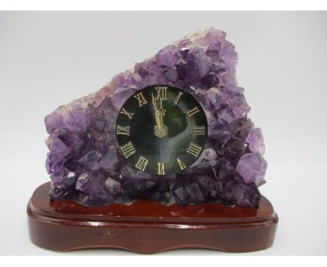 An amethyst crystal geode with inset clock with agate face, height 20cm