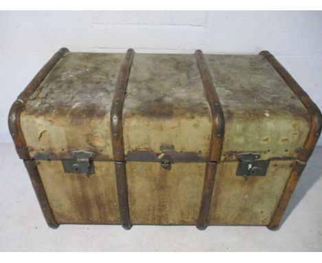 A vintage wooden bound cabin trunk