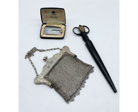 An SCM mesh work purse along with a Ronson Varaflame lighter and a pair of steel Solingen scissors and paper knife in steel s