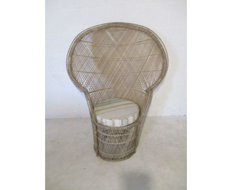 A vintage rattan peacock chair (A/F)