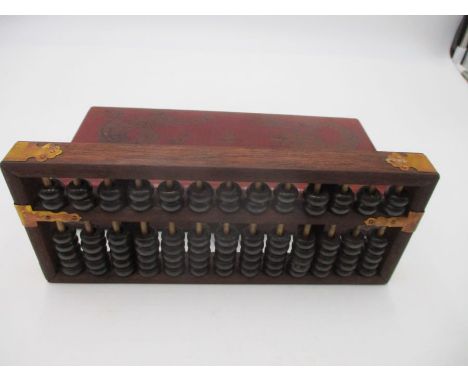 A Chinese abacus in case decorated with a dragon and exotic bird chasing the Flaming Pearl