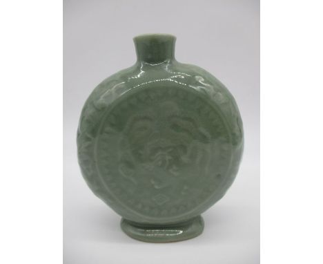 A Chinese Celadon moon flask with embossed dragon, height 15cm