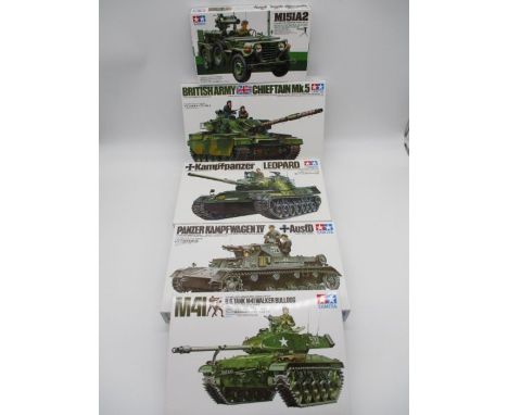 A collection of four boxed Tamiya military miniatures ready to a assemble precision model tank kits including M41 U.S. Walker