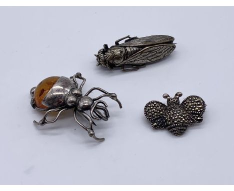 Three vintage "Bug" brooches- a moth, spider with amber body marked 925 along with a marcasite bee