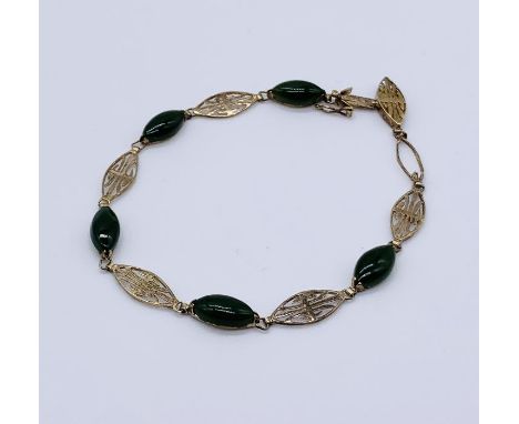 A 14ct gold and jade filigree bracelet- 1 stone missing, total weight 5.5g