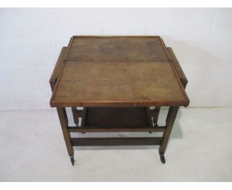 A vintage oak metamorphic tea trolley with presentation label, dated 1939