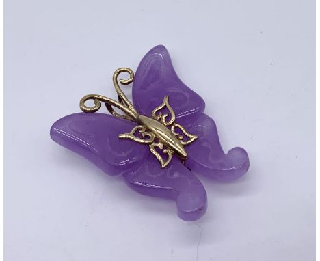 A purple jade butterfly pendant mounted with 9ct gold