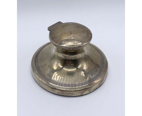 A hallmarked silver capstan inkwell