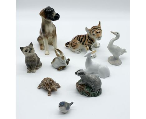 A small collection of ceramic animals including Beswick, Royal Doulton, Lladro, Wade, USSR tiger etc.