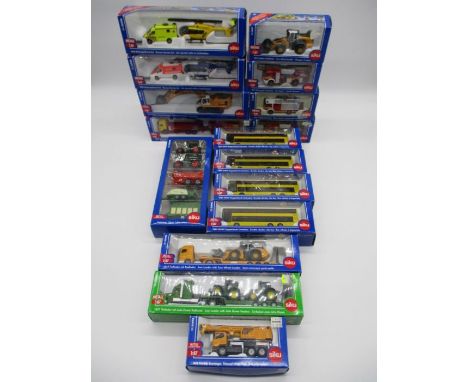 A collection of boxed Siku die-cast vehicles including rescue service sets, four double decker buses (1884), farm vehicle gif