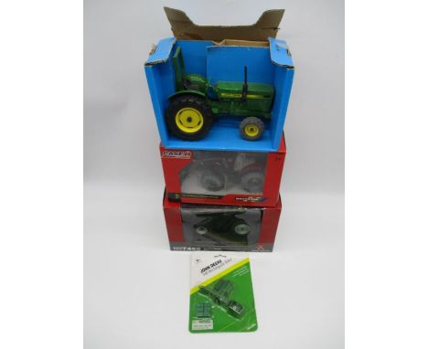 A collection of three die-cast model tractors including a Massey Ferguson 7499 Black limited edition tractor, Britains Case I