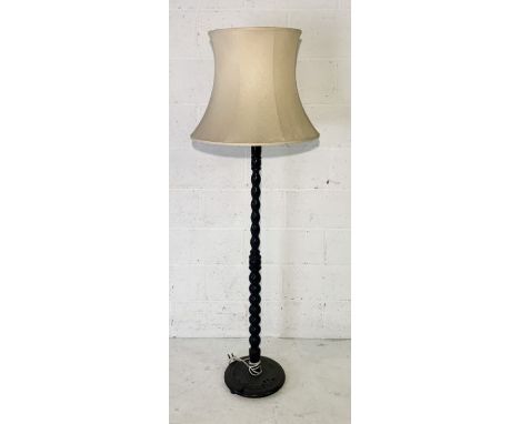 A vintage oak turned standard lamp 