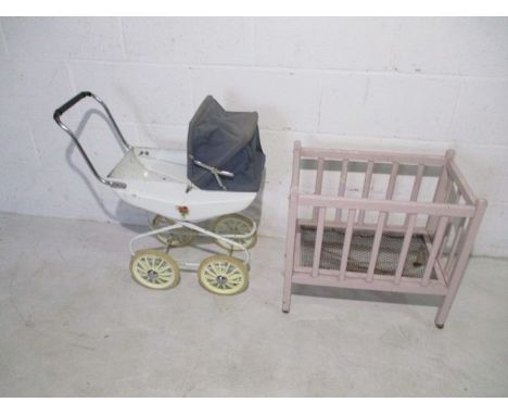 A vintage child's Raleigh pram and wooden framed cot