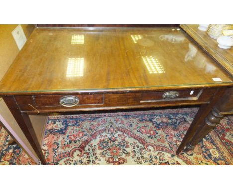 A Victorian mahogany rectangular side table with two drawers to the frieze and brass handles, on square cut section tapering 