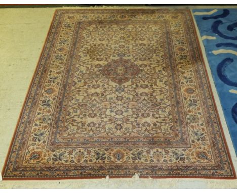 A Prado (Royal Keshan) power loom Persian design carpet with centre medallion on a fawn ground within a similarly decorated b