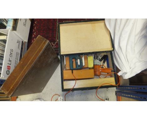 A box containing various hand tools, together with a glazed table top display case and a canteen box for cutlery
