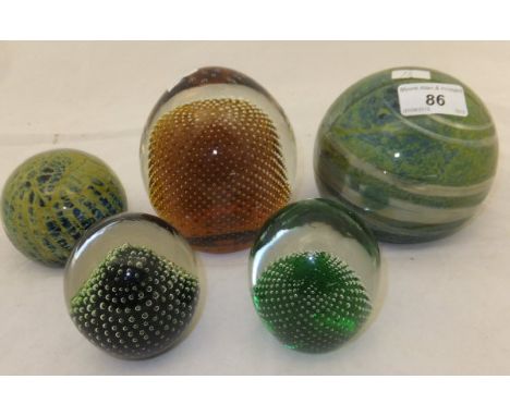 A large Mdina glass paperweight, a smaller version, and three Whitefriars paperweights with internal bubble pattern (5) CONDI