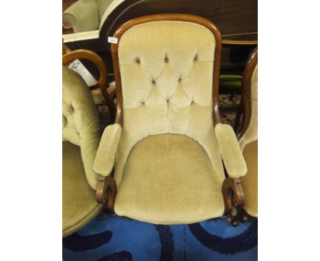 A Victorian mahogany framed armchair in pale yellow button back upholstery