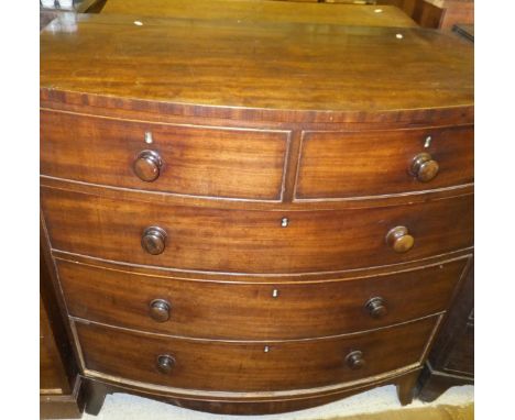 A Victorian mahogany bow fronted chest of two short and three long graduated drawers on splayed bracket feet