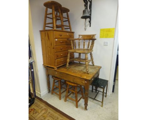 A pine farmhouse kitchen table, a smoker's bow chair, a modern pine chest of five drawers, four stools, and a brass framed ma