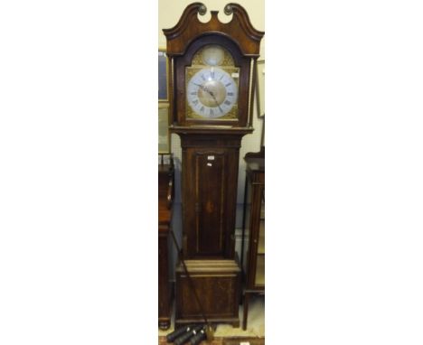 A 19th Century oak cased long case clock with later musical movement and brassed arched dial, with silvered chapter ring, Ara