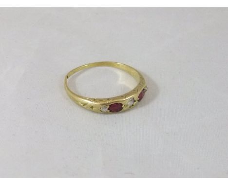 A ruby and diamond set 18 carat gold dress ring