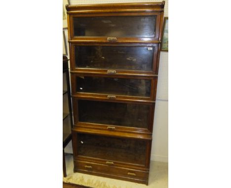 An early 20th Century Globe Wernicke five section bookcase with single drawer base