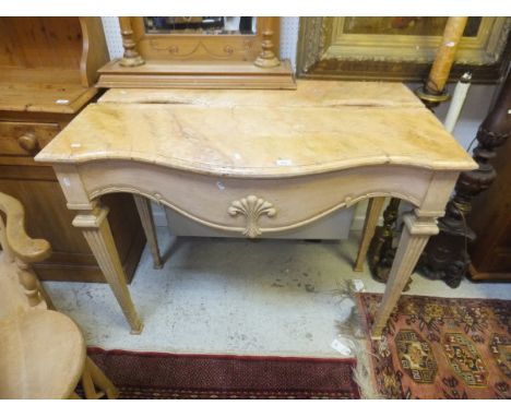 A pair of modern painted console tables, the simulated pink marble tops with serpentine fronts over a moulded frieze, on squa