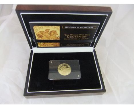 A 9 carat gold double crown coin to commemorate the World War I Centenary (boxed) CONDITION REPORTS Coin appears to be sealed