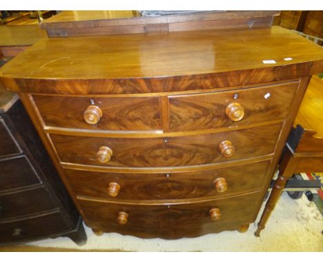 A Victorian mahogany bow fronted chest of two short and three long graduated drawers over a shaped apron to turned feet