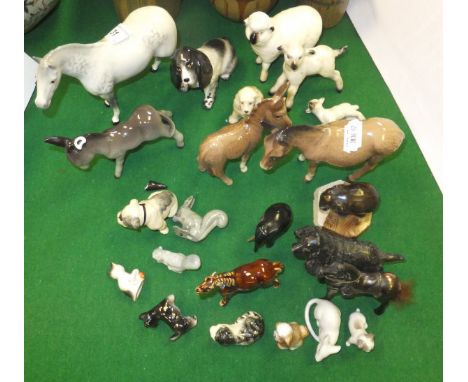 A collection of pottery and other ornaments to include a Beswick dapple grey horse, a Beswick donkey, another smaller Beswick