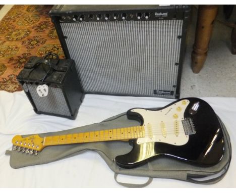 A Fender Squier Stratocaster electric guitar, Serial No. S922809, together with a Hohner Rockwood RW50RC speaker/amp, and a D