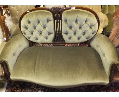 An Edwardian mahogany framed two seat salon settee with acanthus decoration and button back panels