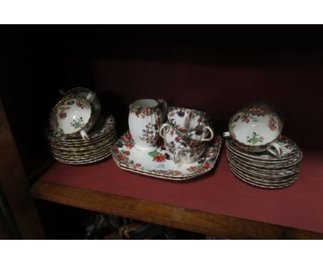 A FINE THIRTY TWO PIECE SPODE CHINA TEASET, the white ground with floral sprays comprising ten tea cups, nine saucers, ten si