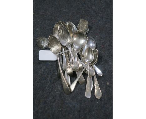 A MISCELLANEOUS COLLECTION OF SPOONS, including a set of six bright cut teaspoons with scallop bowl,  London 1828; eight plai