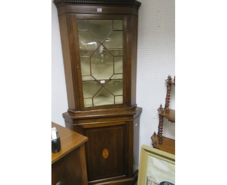 A GEORGIAN STYLE MAHOGANY AND MARQUETRY INLAID CORNER CABINET, the moulded top with dentil rim above an astragal glazed door 