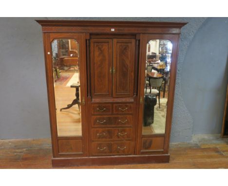 A GEORGIAN STYLE FLAME MAHOGANY AND MARQUETRY INLAID DOUBLE WARDROBE, the moulded cornice with dentil border above a foliate 