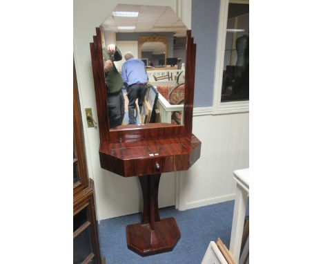 AN ART DECO STYLE ROSEWOOD VENEERED CONSOLE TABLE AND MIRROR, the rectangular plate with canted corners between stepped sides