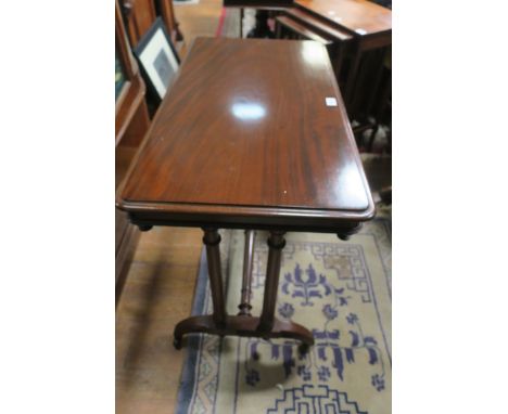 A REGENCY STYLE MAHOGANY SIDE TABLE, the rectangular top with moulded rim and recessed frieze fitted to the underside with sp