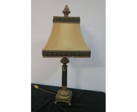 A CONTEMPORARY GILT BRASS FRAMED TABLE LAMP in the form of a classical column headed by a rectangular gold and bead work shad